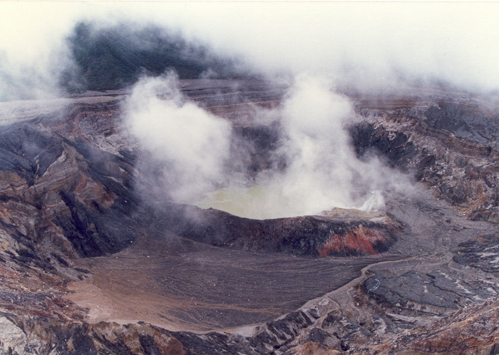 The Poás crater lake is seen here on 4 October 1987 during an intermittent eruption lasting from June 1987 to June 1990. Sporadic small phreatic explosions had started in June 1987 and continued until at least October 1988. The crater lake disappeared by April 1989, and in the following month ash plumes reached heights of 1.5-2 km above the crater.  Photo by José Enrique Valverde Sanabria, 1987 (courtesy of Eduardo Malavassi, OVSICORA-UNA).