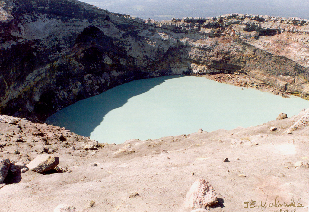 The crater lake of the Cráter Activo of Rincón de la Vieja is seen here on 2 April 1998 from its eastern rim during the 1998 eruption. The eruption began with phreatic explosions during 15-18 February that produced steam plumes up to 2 km above the crater lake, and scorched vegetation on the NE side of the crater. On 16 February a lahar traveled around 12 km down the Penjamo and Azul rivers. Twenty explosions were recognized from seismic records, and additional explosions were recorded in May, June, and September.   Photo by José Enrique Valverde Sanábria, 1998 (courtesy of Eduardo Malavassi, OVSICORI-UNA).