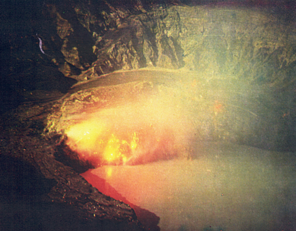 Moderate eruptions with strong gas and ash emission took place from the Poás main crater during March to May 1981. This 19 March time-exposure photograph from the northern crater rim shows an incandescent lava dome.  Photo by Eduardo Malavassi, 1981 (OVSICORA-UNA)