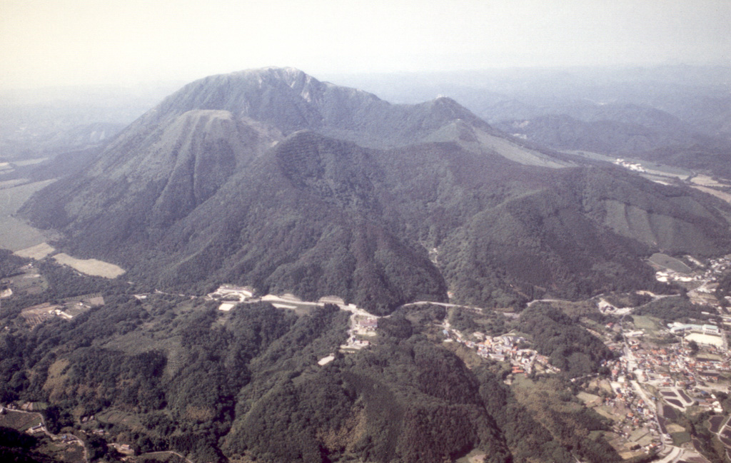 Sanbe is the SW-most Holocene volcano on the island of Honshu. Seen here from the S, the highest peak is called Osanbe. It is flanked by Mesanbe on the right, Kosanbe on the left, and Magosanbe in the center. Sanbe had a large explosive eruption about 3,700 years ago that originated from Taiheizan lava dome. Photo by Yoshinobu Tatsu, 1998 (Shimane Prefectural Sanbe Shizenkan Nature Museum).