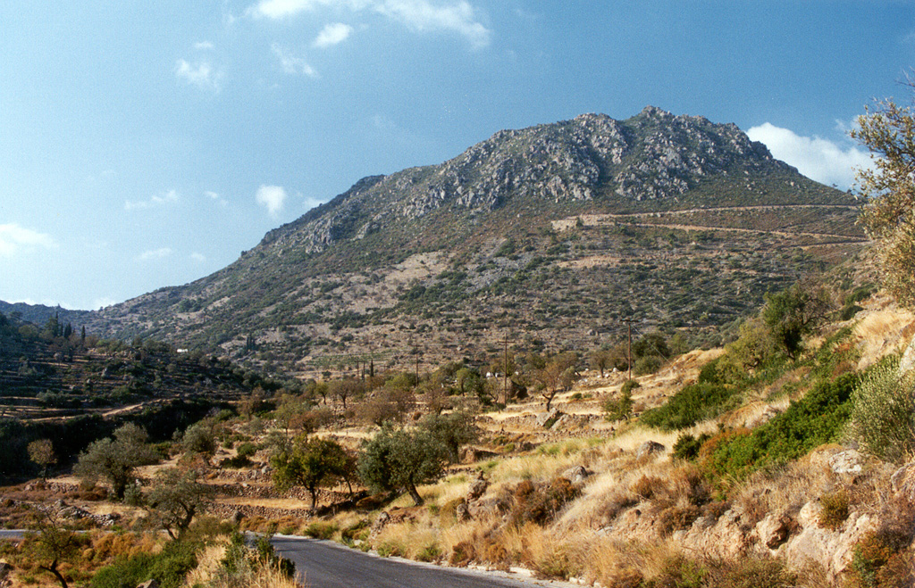 Malja Khoriou lava dome, seen here from the SE, lies on the eastern side of the Methana Peninsula and is one of several lava domes forming the Methana volcanic complex. The peninsula extends into the Sarronian Gulf on the NE side of the Peloponnesus Peninsula. Kameno Vouno is the youngest dome, located on the NW side of the Peninsula where it formed in the 3rd century BCE and produced a lava flow that traveled 500 m beyond the coastline. Photo by Ichio Moriya (Kanazawa University).