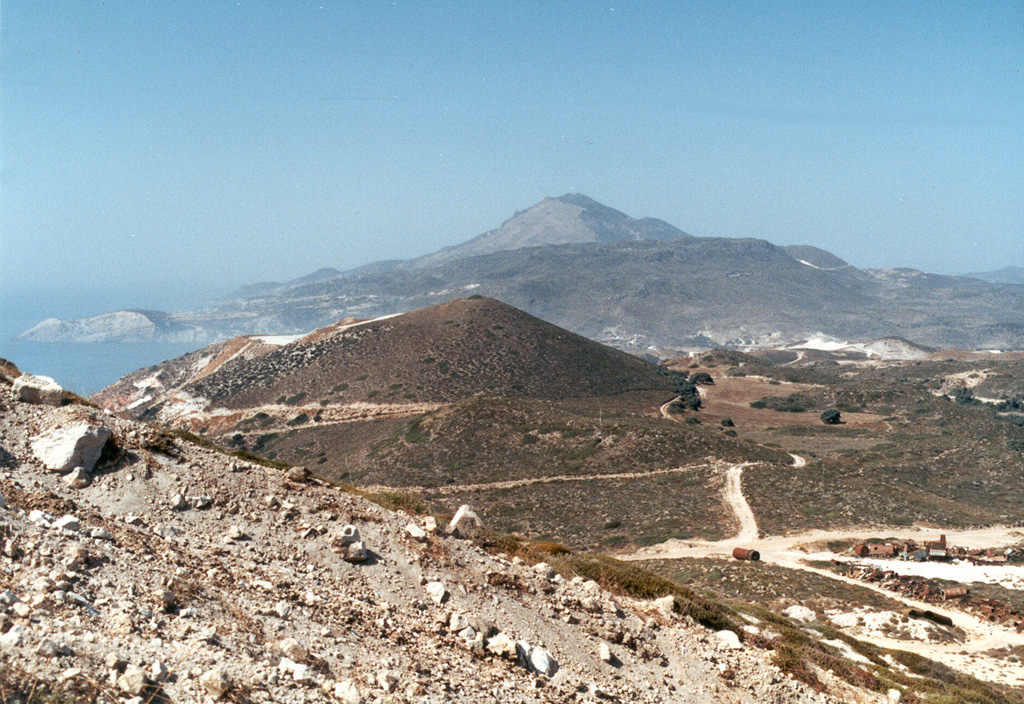 The western side of Mílos Island contains a cluster of lava domes. Mílos and adjacent small islands have grown from submarine and subaerial volcanism that initially was dominantly andesitic and basaltic, but ended with primarily rhyolitic eruptions. Phreatic explosions, commonly producing overlapping craters typically less than 1 km in diameter, continued from late-Pleistocene to Holocene time. Photo by Ichio Moriya (Kanazawa University).