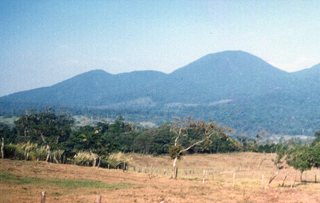 Cerro Montezuma volcano in the Tenorio volcanic complex is seen here from the SW.  The Tenorio complex marks the SE limit of the Guanacaste Range, which extends NW towards the Nicaragua border.  This complex of five volcanic cones along a NNW-SSE trend has a cluster of volcanic domes at its northern end.  No confirmed historical eruptions have occurred at Tenorio.  Despite the report of a volcanic eruption in 1816, the volcano was densely forested at the time of its December 1864 visit by Seebach. Photo by Jorge Barquero, 1987 (OVSICORI-UNA).