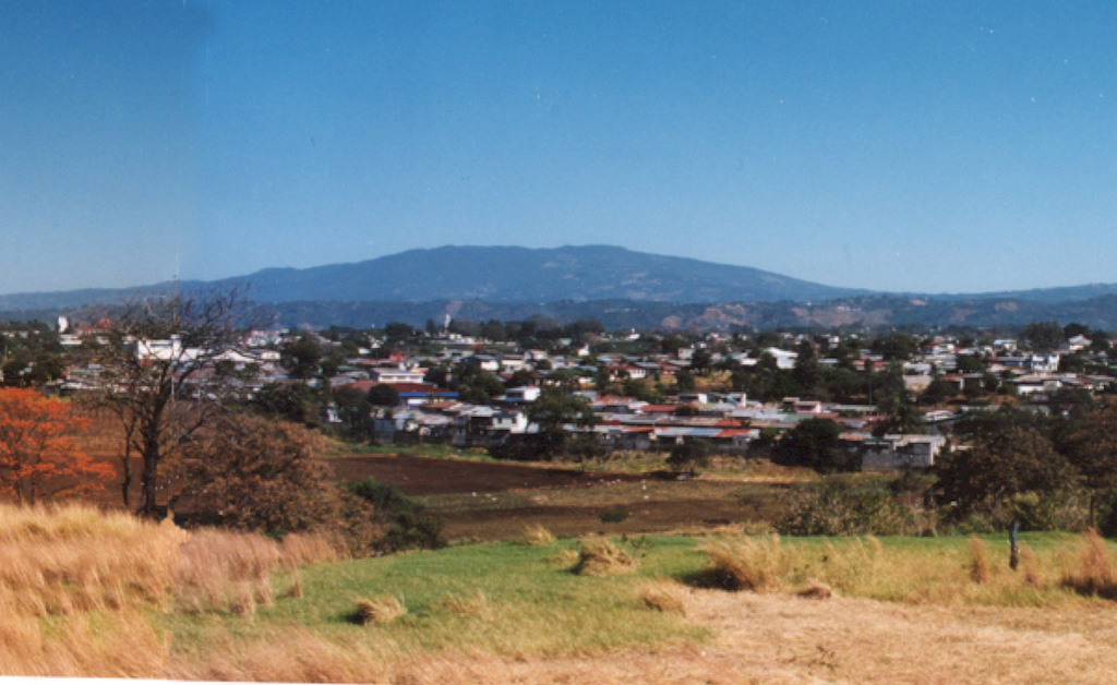 The broad massif of Poás volcano rises about 35 km to the NW above the outskirts of the city of San José.  The summit of the volcano is a national park and is easily accessible by road from the capital city.  The massive 2708-m-high volcano covers an area of about 300 km2 and rises about 1400 m above the central valley.  Two large calderas cut its summit, and an acidic crater lake partially fills the active crater. Photo by Ichio Moriya (Kanazawa University).