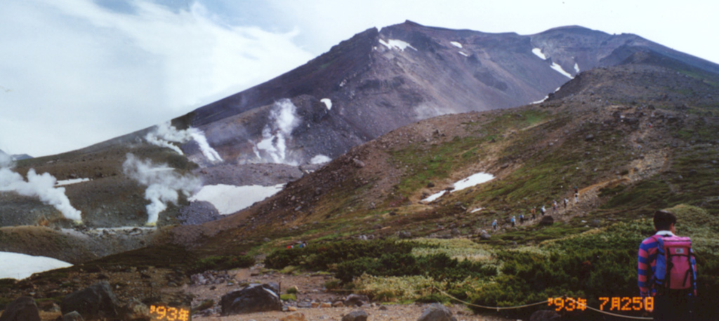 Geothermal activity and recent craters occupy the western slope of Asahidake, one of the Daisetsu group volcanoes in central Hokkaido. Taisetsuzan is a complex group of cones and lava domes associated with a 2-km-wide caldera. Asahidake, the highest peak of the complex, was constructed 3 km SW from the caldera center.  Photo by Ichio Moriya, 1993 (Kanazawa University).