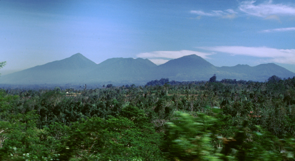 The Bratan volcanic complex in north-central Bali is seen here from the E along the road S of Batur. The Bratan complex contains a 11 x 6 km wide caldera with three lakes in the northern end. In the southern end of the caldera are several post-caldera cones, such as Batukau, Sengajang, and Pohen (left to right). They are thought to have been inactive for hundreds or thousands of years. Photo by Lee Siebert, 2000 (Smithsonian Institution).