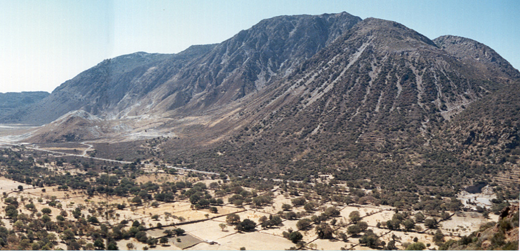 The Mount Hagi Ilias lava dome occupies the western side of a 3-4 km wide caldera at the summit of Nisyros volcano, the easternmost of the Aegean arc. Five large post-caldera lava domes completely fill the western part of the caldera. Historical phreatic eruptions occurred within the caldera between 1422 and 1888. Photo by Ichio Moriya (Kanazawa University).