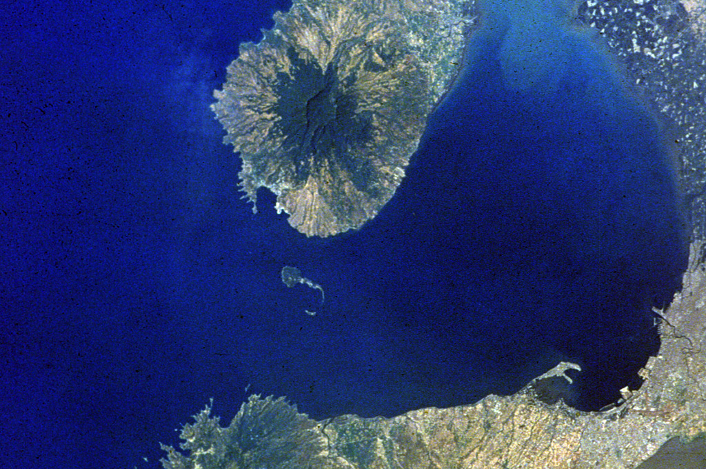 The low-profile Mariveles volcano forms the southern end of the Bataan Peninsula, on the W side of Manila Bay, and contains a 4-km-wide caldera that opens to the N. A Holocene eruption has been radiocarbon dated at 4,000 years before present. The city of Manila at the lower right lies 50 km across the bay from the volcano. NASA Space Shuttle image, 1992 (http://eol.jsc.nasa.gov/).