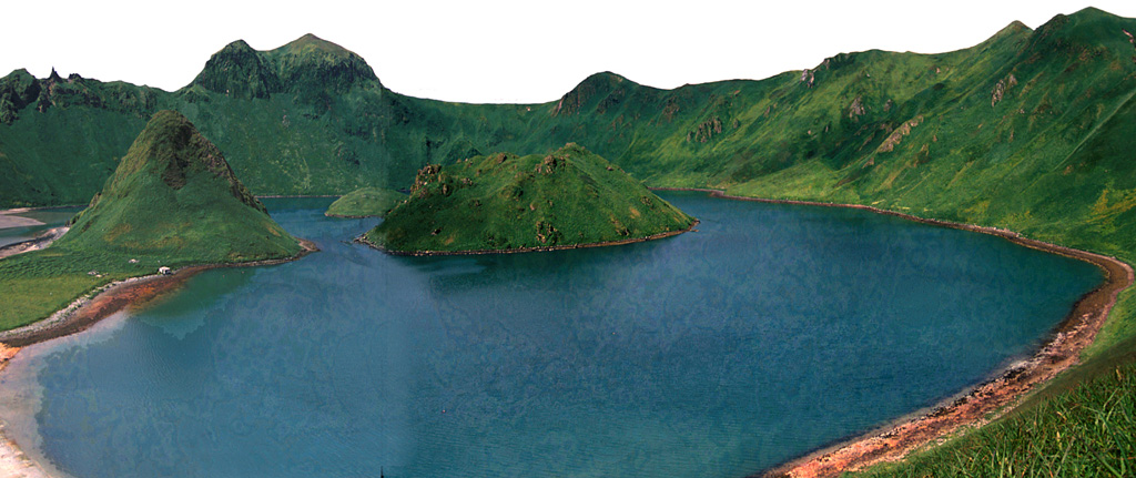 This 1.6-km-wide caldera formed about 9,400 years ago at the summit of Ushishur and now opens towards the south, allowing sea water to fill the caldera. Four lava domes (three of which are visible here) have grown within the caldera. An area containing fumaroles and hot springs along the SE caldera shoreline was a sacred place to Kuril Ainu people in the 18th and 19th centuries. Photo by Yoshihiro Ishizuka, 2000 (Hokkaido University).