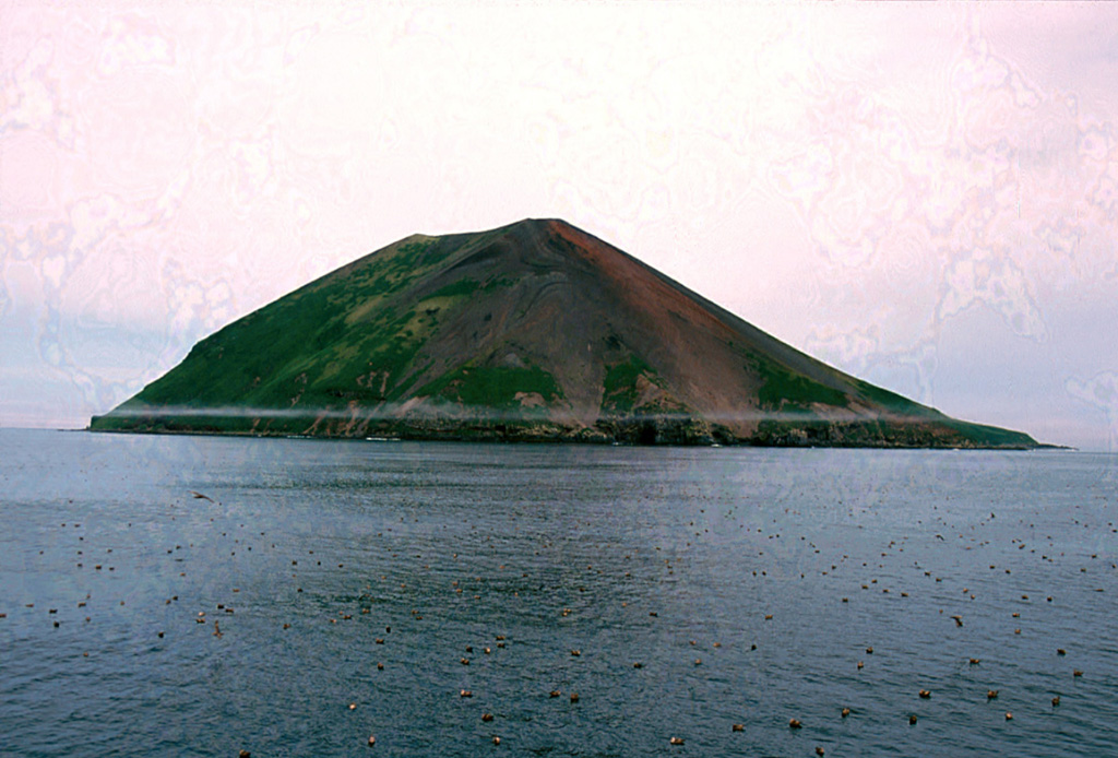 Raikoke Island, seen here from the SE, lies 50 km SW of Shiashkotan Island and 16 km across the Golovnin Strait to the NE of its closest neighboring volcano on Matua Island. The island is only 2 x 2.5 km wide and rises about 550 m above the ocean; a submarine terrace is at a depth of 130 m. A catastrophic eruption in 1778 prompted the first volcanological investigation in the Kuril Islands two years later.  Photo by Yoshihiro Ishizuka, 2000 (Hokkaido University).