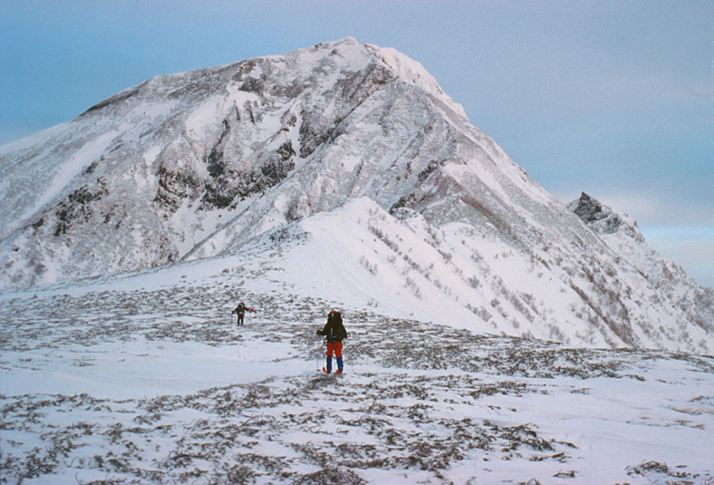 This photo shows the saddle between Nipesotsudake and Maruyama lava dome. The Nipesotsu-Maruyama volcano group, located E of Tokachidake, is composed of a number of overlapping lava domes constructed along a NW-SE trend. A minor phreatic eruption took place at Maruyama lava dome in 1898, and fumaroles are active on one of its summit craters. Copyrighted photo by Yoshihiro Ishizuka, 1998 (Japanese Quaternary Volcanoes database, RIODB, http://riodb02.ibase.aist.go.jp/strata/VOL_JP/EN/index.htm and Geol Surv Japan, AIST, http://www.gsj.jp/).