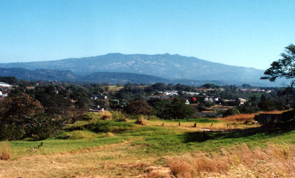 Barva volcano (also spelled Barba) rises to the NE above the western outskirts of San José.  The volcano lies about 22 km north of the city.  Three peaks along the broad summit ridge give rise to the name Las Tres Marías (The Three Marias).  No confirmed historical eruptions are known from Barva, but thermal springs are found near Porrosati de Barva, Gongolona peak, and along ridges to the north side of the volcano.  Sulfur vapor and mineral deposition occurs at landslide scarps on the flanks of the volcano. Photo by Ichio Moriya (Kanazawa University).