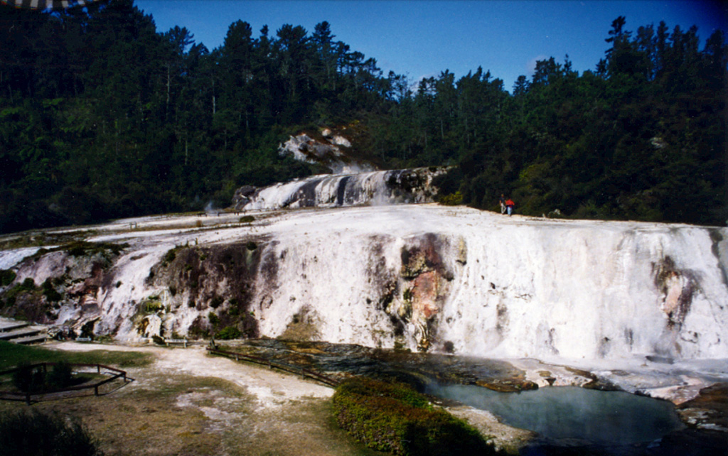 Siliceous sinter terraces located within the at Orakei Korako thermal areas in New Zealand. The thermal area lies along the Waikato River at an elevation of 260-360 m on the E side of the Maroa volcanic center. Hydrothermal explosions took place at five centers at Orakei Korako prior to the Taupo pumice eruption about 1,800 years ago, depositing explosion breccias that immediately underlie the Taupo Pumice. Photo by Richard Wysoczanski, 1994 (Smithsonian Institution).