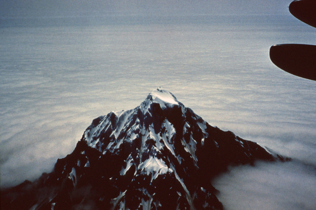 Chagulak forms a small 3-km-wide island NE of Amukta. The two volcanoes coalesce at depth although they are separated by 7 km of ocean. Photo by Dan Rogers, 1961 (courtesy of Alaska Volcano Observatory).