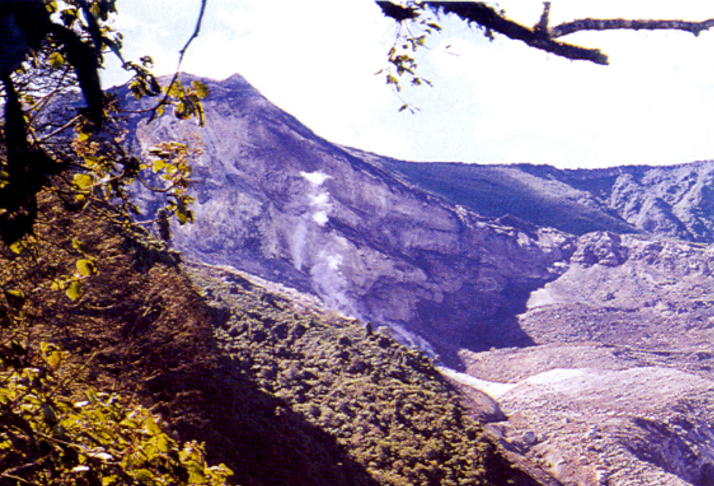 This view of the less-frequently seen northern side of Irazú's summit crater complex shows fumaroles rising from vents below a steep escarpment cutting the outer NW flank of the volcano's main crater (which lies behind the high point on the left horizon).  This thermal area, known as Las Fumaroles, was the source of an explosive eruption in December 1994 that also produced an avalanche and mudflow down the Río Sucio, the valley at the lower right. Photo by Jorge Barquero, 1994 (Universidad Nacional Costa Rica).