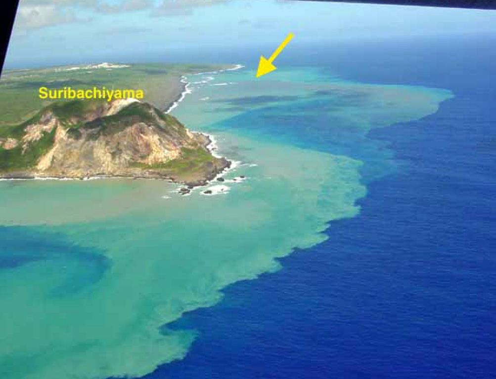 The discolored water seen here is from the September 2001 Ioto submarine eruption, with the vent marked by the yellow arrow. The island is located within a 9-km-wide submarine caldera and narrows toward its SW tip, where the Suribachiyama cone is located. Numerous phreatic eruptions and uplift over at least the past 700 years has accompanied resurgent doming of the caldera. Photo by Nakahori, 2001 (Japan Meteorological Agency, published in the Bulletin of the Global Volcanism Network).