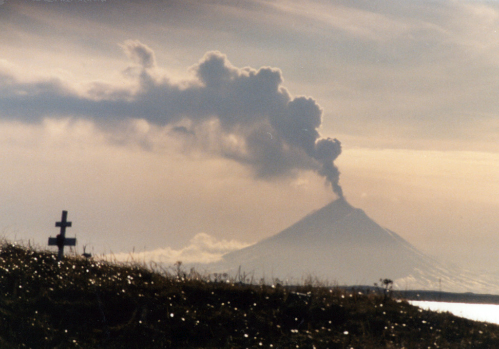 An ash plume rises above Pavlof volcano on 13 November 1996, as seen from Nelson Lagoon about 70 km NE. Intermittent small ash and Strombolian eruptions began on 15 September and lava fountains produced a lava flow. Eruption plumes rose above 6.7 km altitude on four days between 18 October and 11 December 1996. Photo by Elgin Cook, 1996 (U.S. Geological Survey, Alaska Volcano Observatory).