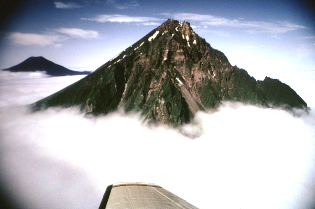 The eastern side of the Chagulak volcano is seen here in the foreground and Amukta is in the background. The two volcanoes join at depth but at the surface they are separated by 7 km of ocean. Photo by Fred Deines, 1992 (U.S. Fish and Wildlife Service).