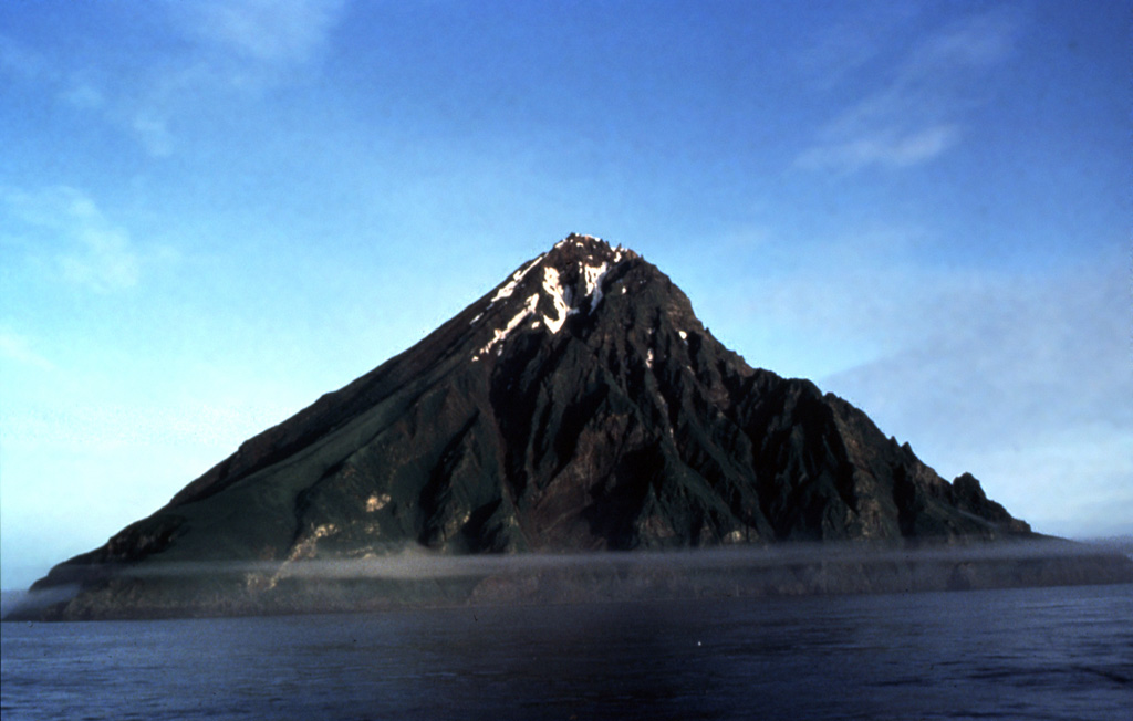 The eastern side of the 3-km-wide island of Chagulak island is shown here. This is one of two peaks of a larger underwater edifice located NE of Amukta, the other peak. Photo by B. Anderson, 1992 (U.S. Fish and Wildlife Service).