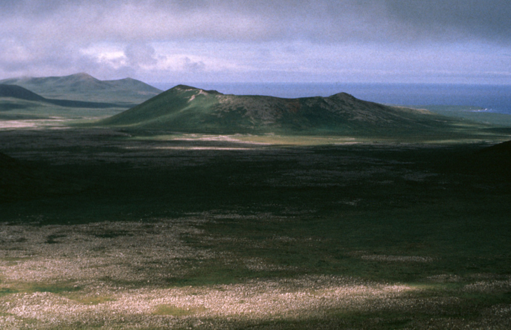Crater Hill, on the western side of St. Paul Island, is one of many cones on the 110 km2 island. The complex crater is 200 m deep and has several smaller cones within it, as well as a 50-m-thick lava flow.  Photo by Art Sowls, 1988 (U.S. Fish and Wildlife Service).