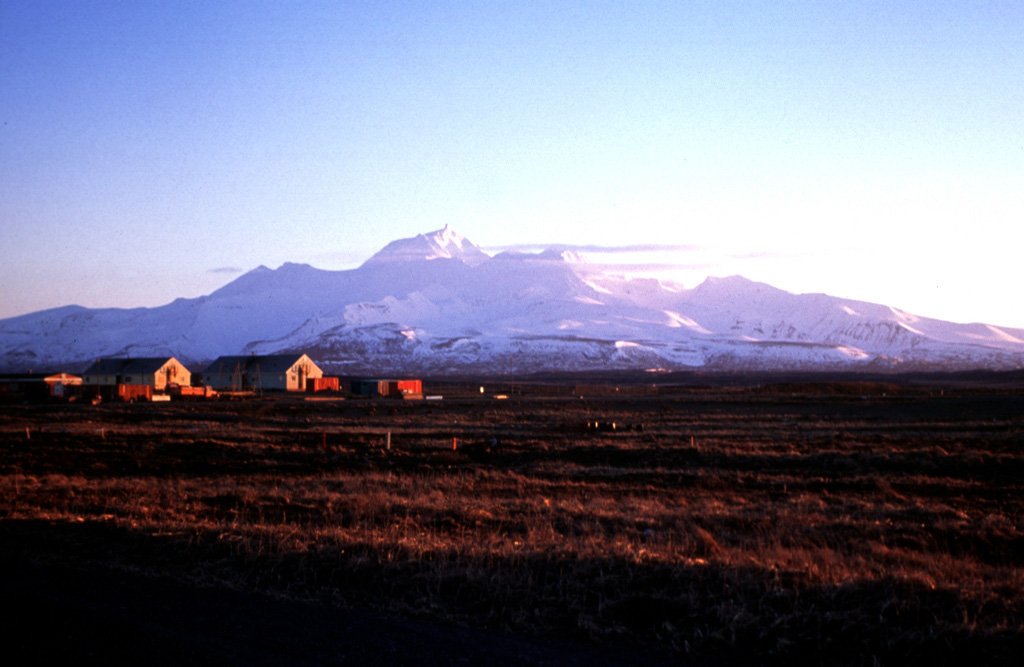 Frosty is the youngest of two large volcanic structures of the Cold Bay volcanic complex, about 15 km SW of Cold Bay at the tip of the Alaska Peninsula. Frosty Peak was constructed within the southernmost of two coalescing craters during the late-Pleistocene to Holocene, and forms the high point of the complex. Photo by Christina Neal, 1997 (Alaska Volcano Observatory, U.S. Geological Survey).