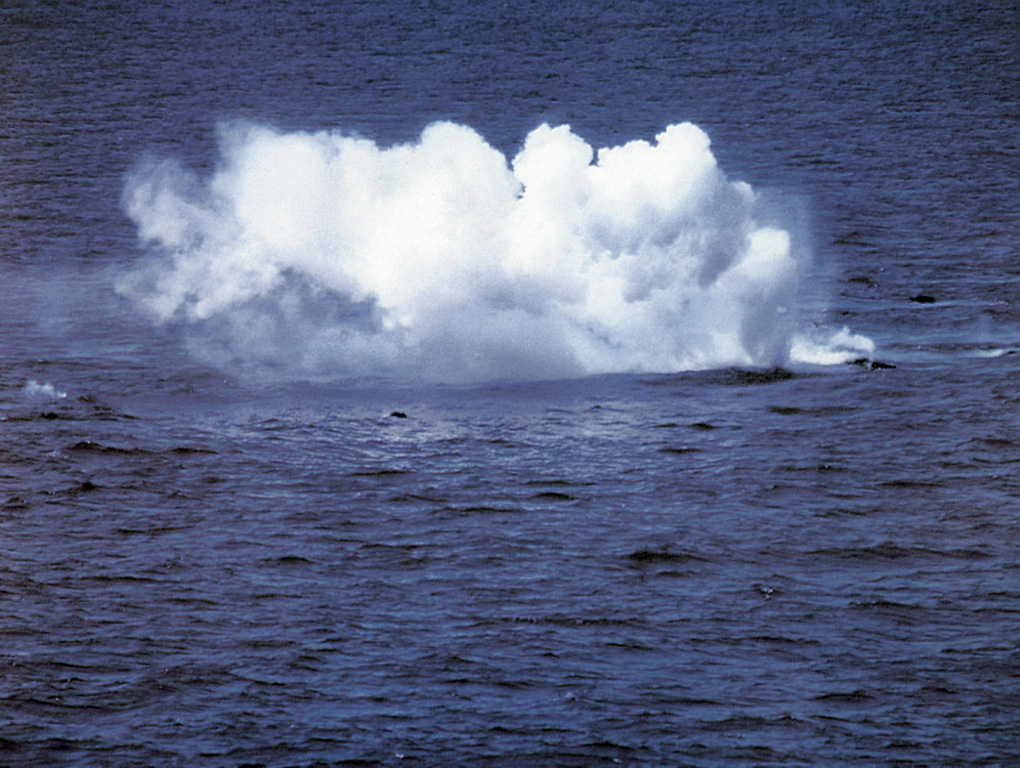 During a submarine eruption that was first observed on 29 January 1993, small explosions were produced when floating hot rocks fractured and their hot interiors came in contact with sea water. Large blocks of dark-gray, highly-vesiculated basalt up to 5 m in diameter rose to the surface. During individual pulses at irregular intervals, tens of blocks accompanied by bubbles could be observed rising through the water column. The blocks emitted loud hissing and crackling noises from thermal expansion prior to breaking up into smaller pieces and sinking. Photo by Hugo Delgado-Granados, 1993 (Universidad Nacional Autónoma de México).