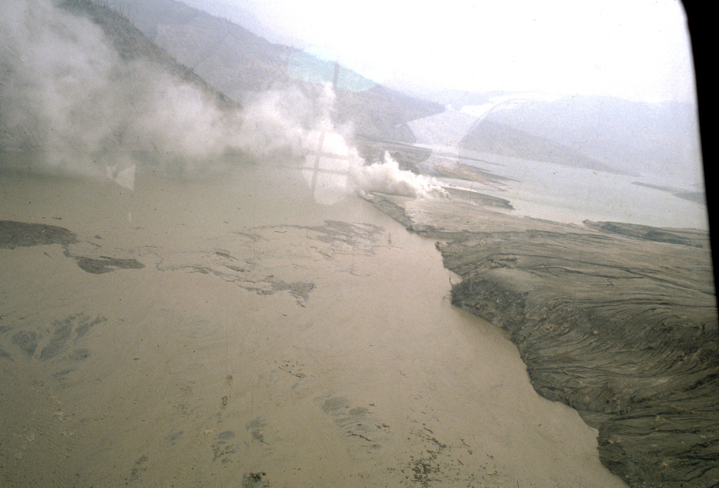 Major pyroclastic flow deposits of the 3-4 April 1982 eruptions at El Chichón formed natural dams blocking the Rio Magdalena. This tephra dam was located about 4.5 km WSW of the crater and produced a lake that eventually reached 4 km in length and had a volume of 26 million cubic meters. It failed catastrophically about seven weeks after the end of the eruption (26 May), causing a massive lahar with temperatures reaching 82°C that destroyed a bridge and damaged a hydroelectric site, killing one worker and badly scalding three others. Photo by Servando De la Cruz-Reyna, 1982 (Universidad Nacional Autónoma de México).