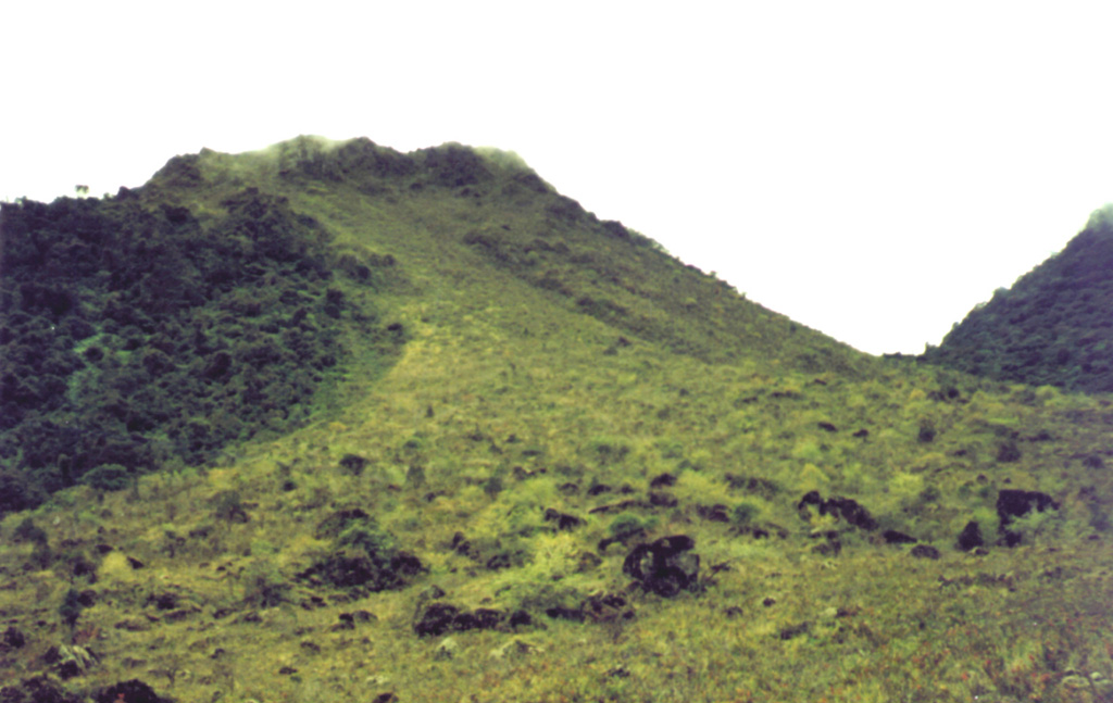 Vegetation drapes one of the peaks forming the Peuet Sague complex in NW Sumatra. This isolated volcano is a several-day journey on foot from the nearest village and is infrequently visited. The first recorded historical eruption took place during 1918-21, when explosive activity and pyroclastic flows accompanied lava dome growth. Photo by R.D. Erfan (Volcanological Survey of Indonesia).