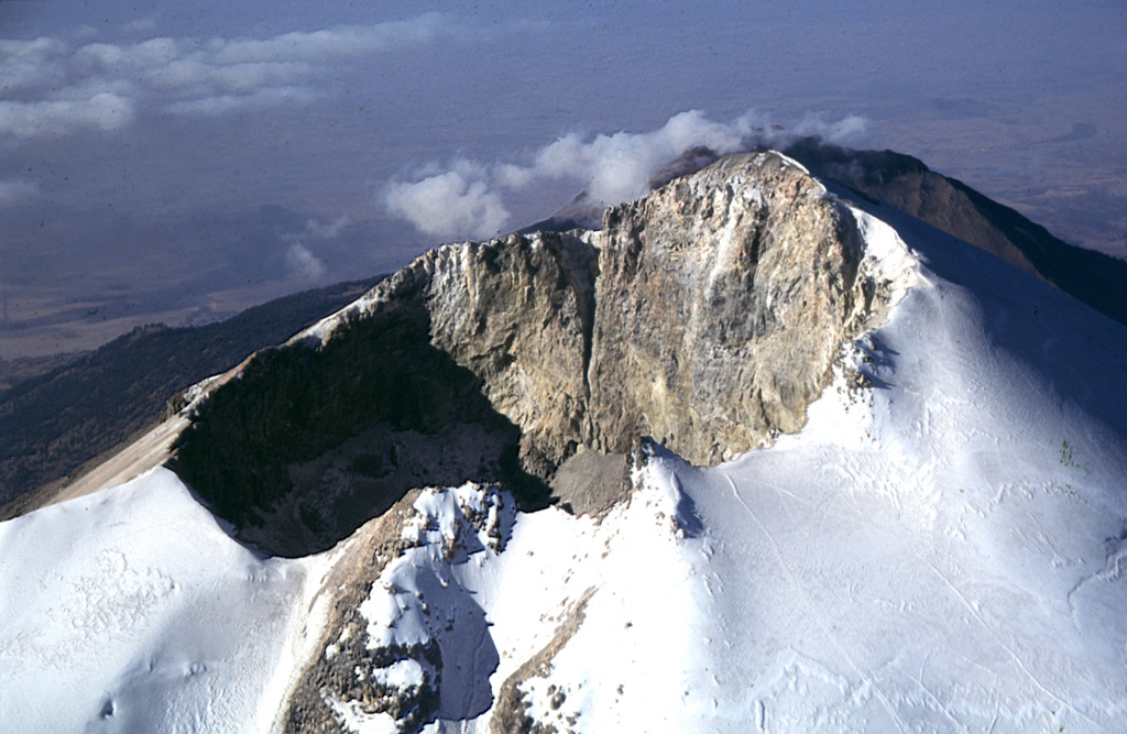 The Pico de Orizaba summit crater is 400 x 500 m with a crater floor 300 m below the summit on the NW side of the rim. Climbers' tracks can be seen on the Jamapa Glacier to the lower right.  Photo by Gerardo Carrasco-Núñez, 1997 (Universidad Nacional Autónoma de México).