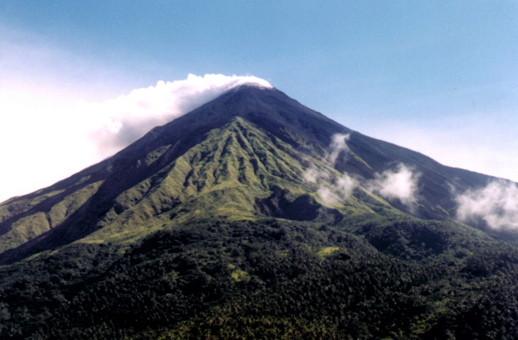 Karangetang (Api Siau) is one of Indonesia's most active volcanoes.  Twentieth-century eruptions have included frequent explosive activity that is sometimes accompanied by pyroclastic flows and lahars.  Lava dome growth has occurred in the summit craters; collapse of lava flow fronts has also produced pyroclastic flows.   Photo by Volcanological Survey of Indonesia.