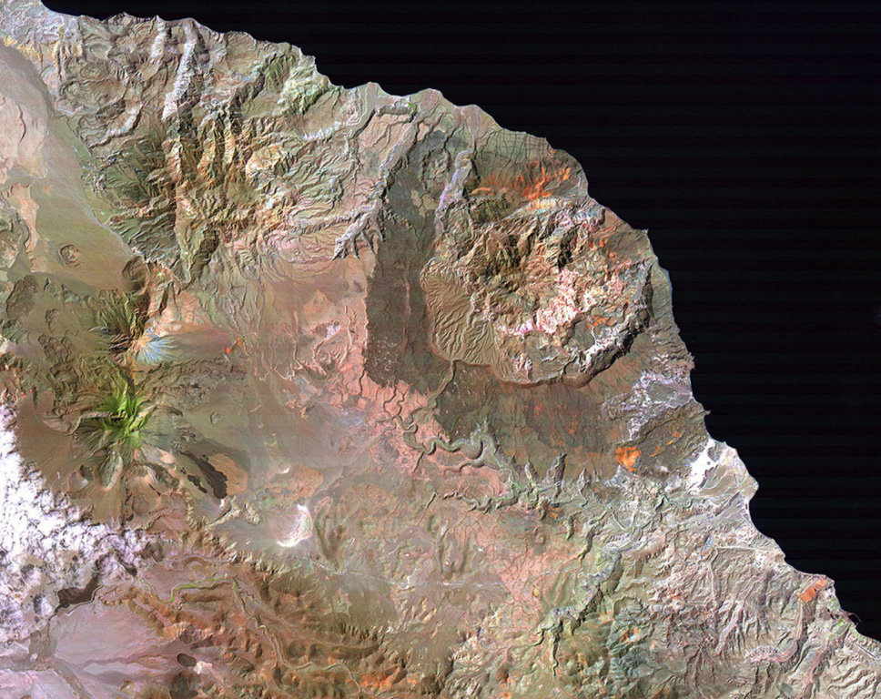 Three major Quaternary volcanic complexes are visible in this Landsat satellite image of Baja California. The N-S-trending Las Vírgenes volcanic complex to the left consists of three stratovolcanoes that are progressively younger towards the south. The 10-km-wide La Reforma caldera along the Gulf of California coast to the right displays darker andesite flanks and a resurgent dome in the center. The extensively eroded El Aguajito caldera has indistinct margins but the large resurgent dome forms the roughly circular eroded hills west of La Reforma. NASA Landsat image (processed by Brian Hausback, UC Sacramento).