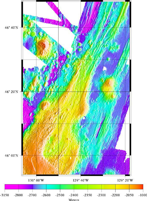 The linear NE-SW-trending CoAxial Segment (center) of the Juan de Fuca Ridge is located about 435 km W of the Oregon coast. It lies NE of Axial volcano, which is in the bottom-left of this map. A submarine eruption along the CoAxial segment detected by acoustic hydrophones in June 1993 produced thermal plumes and a new lava flow. Bathymetric surveys indicated that one or more additional sea floor lava extrusions took place nearby sometime between 1981-82 and 1991. Image courtesy of National Oceanic and Atmospheric Administration (http://www.pmel.noaa.gov/vents/home.html).