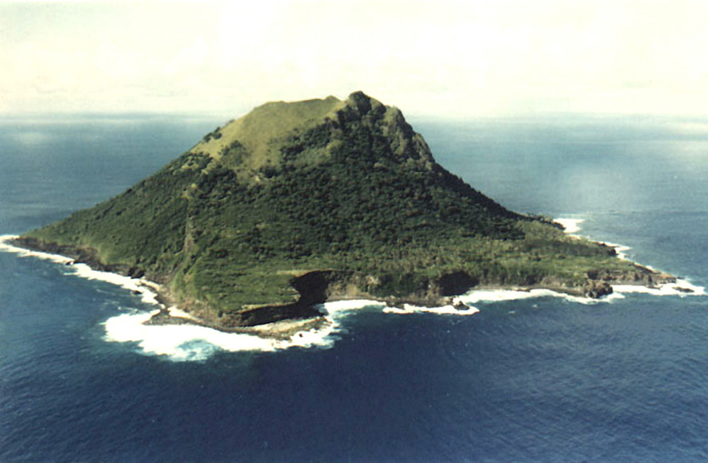The 1.5-km-wide, steep-sided island of Meheti’a, seen here from the south, is the youngest and SE-most of the Society Islands. Wave erosion has exposed older lava flows, leaving steep cliffs that overlie coral reefs.  Photo by Jacky Vedraine (http://www.polynesiepassion.net).