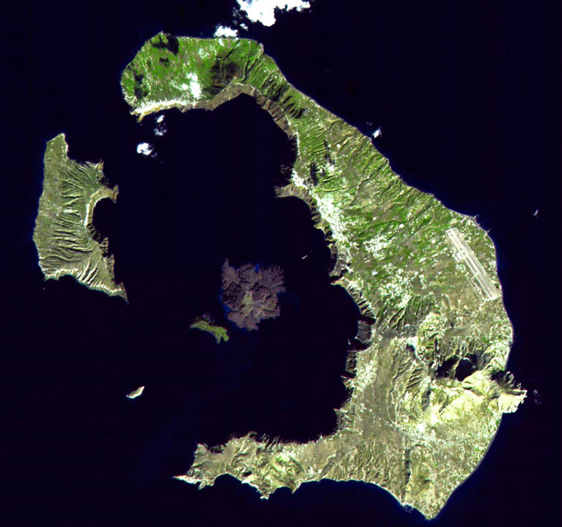The mostly-submerged caldera of Santorini volcano is seen from space in this NASA satellite image. The 7.5 x 11 km caldera was formed during at least four major explosive eruptions, the last of which occurred about 1,650 BCE. The arcuate islands of Thira (right) and Therasia (left) form the outer flanks of the caldera. Nea Kameni Island is near the center of the caldera, which along with Palea Kameni Island to its left, is part of a post-caldera cone formed during historical eruptions dating back to 197 BCE. NASA ASTER image, 2000 (http://eol.jsc.nasa.gov/).