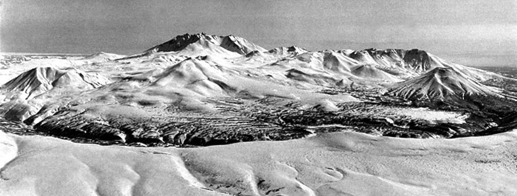 Bolshoi Semiachik is a group of late Pleistocene-Holocene cones and domes located within a large caldera. The massif is seen here from the western rim (Bort ridge). Bolshoi Semiachik volcano is the large late-Pleistocene edifice on the near the center of the horizon. Several Holocene extrusive domes and vigorously active thermal fields are located W and SW of the volcano. Copyrighted photo by Nikolai Smelov (Holocene Kamchataka volcanoes; http://www.kscnet.ru/ivs/volcanoes/holocene/main/main.htm).