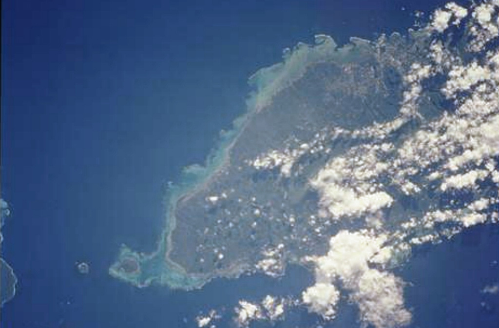 The massive, basaltic shield volcano forming 75-km-long Upolu Island in Samoa is seen in this Space Shuttle view (with north to the upper left). The youngest lava flows, erupted after a lengthy period of erosion, originated from vents near the crest of the island and may be only a few hundred to a few thousand years old. Apolima Island, the small circular island west of reef-bounded Manono Island off the western tip of Upolu (lower right), is a Holocene tuff cone too young to be fringed by a coral reef. NASA Space Shuttle image STS111-715-29, 2002 (http://eol.jsc.nasa.gov/).