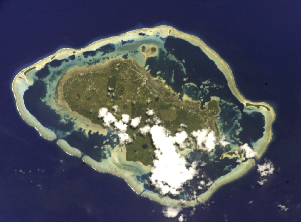 A barrier reef surrounds the Wallis Islands in this International Space Station view (N is to the left). Small explosion craters are visible on the 7 x 14 km Uvea Island. Uvea and the other low forested islands within the barrier reef are formed of flat-lying basaltic lava flows that are cut by explosion craters and capped by tuff cones and the scoria cones. Tuff cones and other features were considered to have been formed during the Pleistocene and Holocene based on morphology. NASA International Space Station image ISS002-E-9888, 2001 (http://eol.jsc.nasa.gov/).