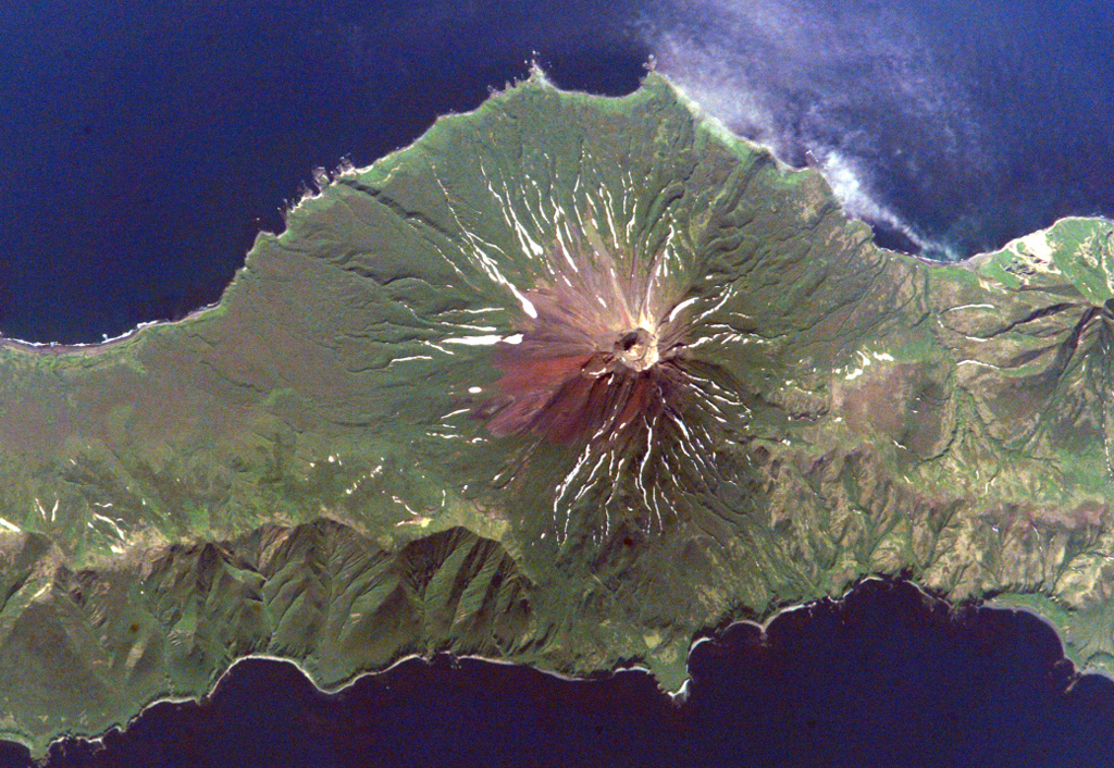 Prevo Peak in central Simushir Island is shown in this Space Shuttle image (N to the lower left) with its 450 x 600 m summit crater and lava flows that reach both coasts. The flanks of the Pleistocene Ikanmikot volcano appear to the far right. NASA International Space Station image ISS005-E-6313, 2002 (http://eol.jsc.nasa.gov/).