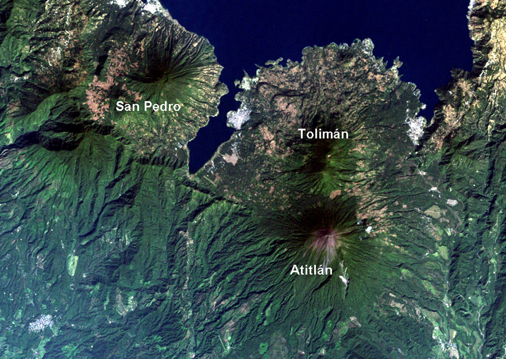 Lake Atitlán fills the northern part of the Atitlán caldera complex. The caldera formed in three stages: Atitlán I caldera about 11 million years ago (Ma), Atitlán II caldera about 8 Ma, and Atitlán III caldera about 84,000 years ago. The southern margin of the first caldera lies near the southern shore of the 18-km-wide lake, San Pedro and Tolimán volcanoes were constructed over the southern margin of the second caldera, and Atitlán over the third. NASA Landsat image, 2000 (courtesy of Loren Siebert, University of Akron).