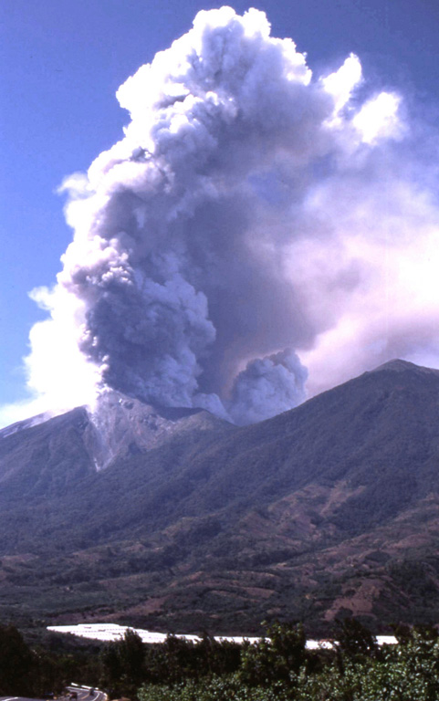 An eruptive episode at Fuego began on 4 January 2002 and continued intermittently into 2003. This 8 January 2002 image taken from the east shows an ash plume. Effusion of lava flows down the east flank began in late January 2002. On 2 August 2002 explosive activity changed from Strombolian to Vulcanian. Photo by Sid Halsor, 2002 (Wilkes University).