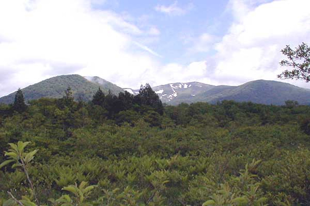 Kurikomayama is seen from the SSE with its summit at the right-center, the Daichimori cone on the left, and Higashi Kurikoma on the right. Minor phreatic eruptions have been recorded from the central cone. Copyrighted photo by Shingo Takeuchi (Japanese Quaternary Volcanoes database, RIODB, http://riodb02.ibase.aist.go.jp/strata/VOL_JP/EN/index.htm and Geol Surv Japan, AIST, http://www.gsj.jp/).