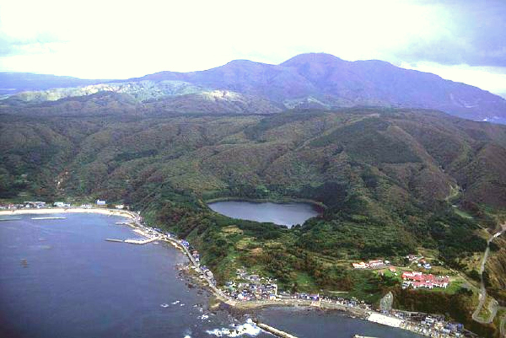 Sannomegata (center), seen here from the NW with Toga bay in the foregound, is one of three small Megata maars along the tip of the Oga Peninsula. Lakes 300-700 m wide fill the maars, which are noted localities for mantle-derived xenoliths and are located immediately E and S of Toga Bay. Copyrighted photo by Hiroshi Yagi (Japanese Quaternary Volcanoes database, RIODB, http://riodb02.ibase.aist.go.jp/strata/VOL_JP/EN/index.htm and Geol Surv Japan, AIST, http://www.gsj.jp/).