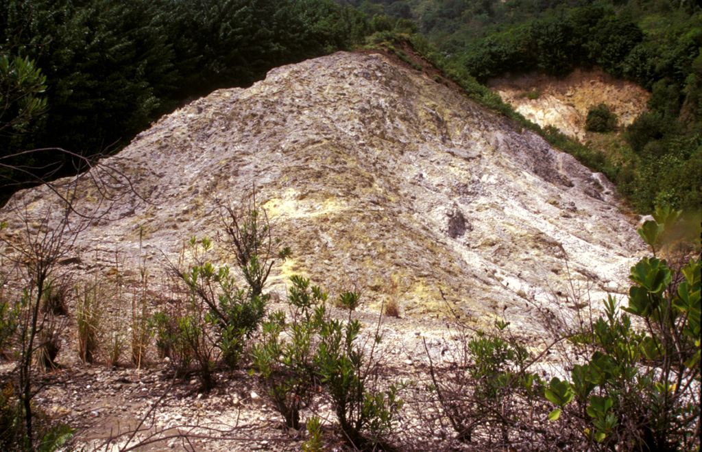 The Sulfur Springs thermal area was the site of combustion and melting of sulfur deposits in 1994 that produced a sulfur flow over an area of about 1 km2, prompting reports of a volcanic eruption.  Measured fumarole temperatures at Sulfur Springs have ranged between about 90 and 100 degrees Centigrade over the past century. Photo by Paul Kimberly, 2002 (Smithsonian Institution).