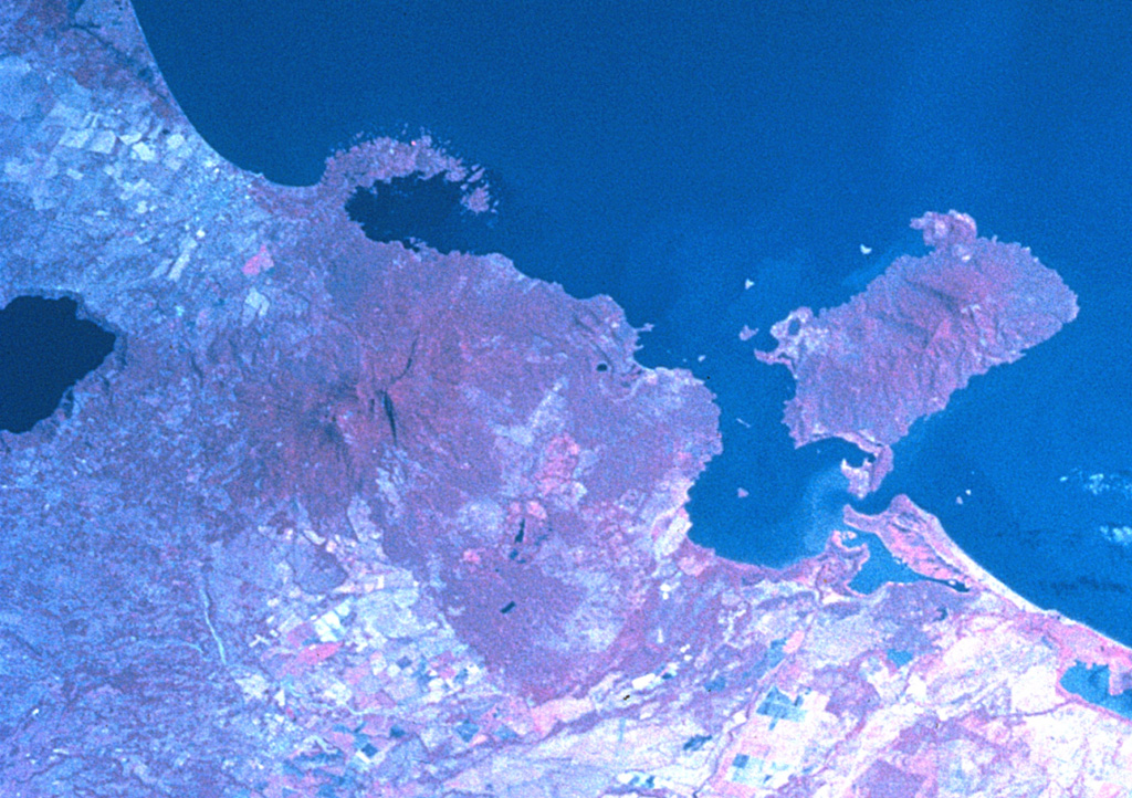 Two major scarps cutting Mombacho volcano (left-center) were the sources of major debris avalanches.  The arcuate peninsula and island chain extending into Lake Nicaragua (known as Las Isletas or Isletas de Granada) was produced by collapse of Mombacho to the NE.  The island at the right is Zapatera, a small shield volcano and maar complex.  The lake at the far left fills late-Pleistocene Apoyo caldera, and the roughly N-S-trending Granada cinder cone alignment lies NNW of Mombacho and east of Lake Apoyo in this NASA Space Shuttle image (with north to the upper left). NASA Space Shuttle image STS081-742-25, 1997 (http://eol.jsc.nasa.gov/).