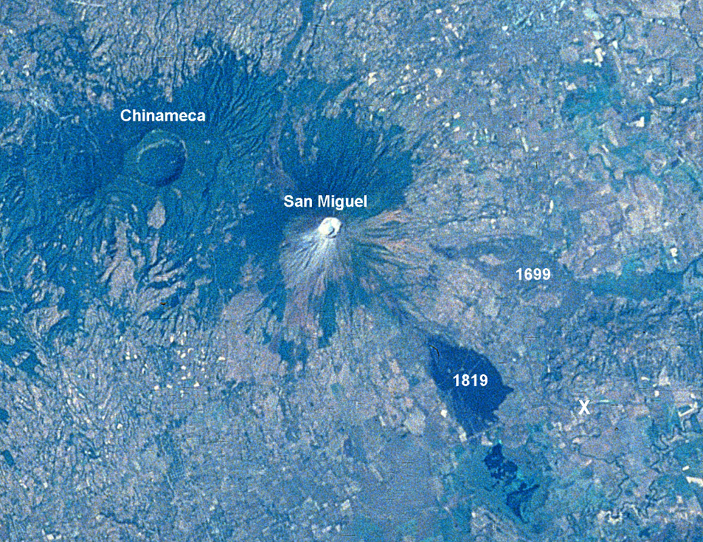 A large eruption took place from San Miguel in 1699, accompanied by strong earthquakes, flames, and rumblings.  A major lava flow (right-center) traveled from SE-flank fissures for a straight-line distance of nearly 9 km.  The flow divided around a light-colored kipuka and then banked against Pleistocene volcanic hills, where it was deflected to the south in a narrow lobe to the point labeled "X."  The 2.5-km-wide caldera of Chinameca volcano lies across a saddle from San Miguel in this Space Shuttle image with north to the upper left.  NASA Space Shuttle image STS61C-31-47, 1986 (http://eol.jsc.nasa.gov/).