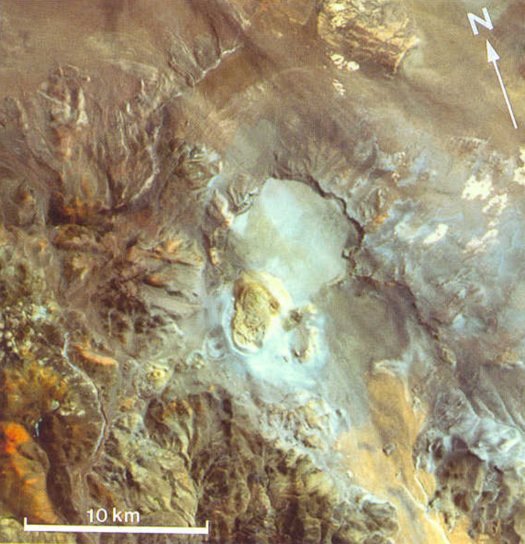 The circular light-colored area in the center of this Thematic Mapper image is the 6-km-wide Robledo caldera.  The Cerro Blanco del Robledo rhyolitic lava dome on the southern rim of the caldera was extruded into a pumice cone (pale tones).  The margins of pyroclastic flows erupted prior to extrusion of the lava dome are faintly visible on the caldera floor and on the NW flanks of the caldera.  Satellite geodetic surveys in the central Andes showed subsidence of Robledo caldera in the 1990s.    Thematic Mapper image (de Silva and Francis, 1991; courtesy of Matthew Pritchard, California Institute of Technology).
