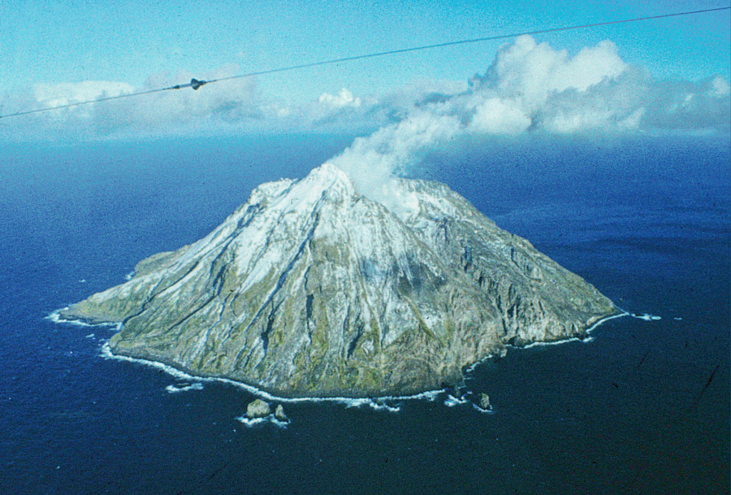 The 3-km-wide island of Chirinkotan is the emergent summit of a volcano that rises 3 km from the floor of the Kuril Basin. It lies at the far end of an E-W-trending volcanic chain that extends nearly 50 km W of the central part of the main Kuril Islands arc. Historical eruptions have been recorded here since the 18th century, including one observed by Captain Snow. Photo by R. Bulgakov, 1990 (Institute of Marine Geology and Geophysics, Yuzhno-Sakhalin).