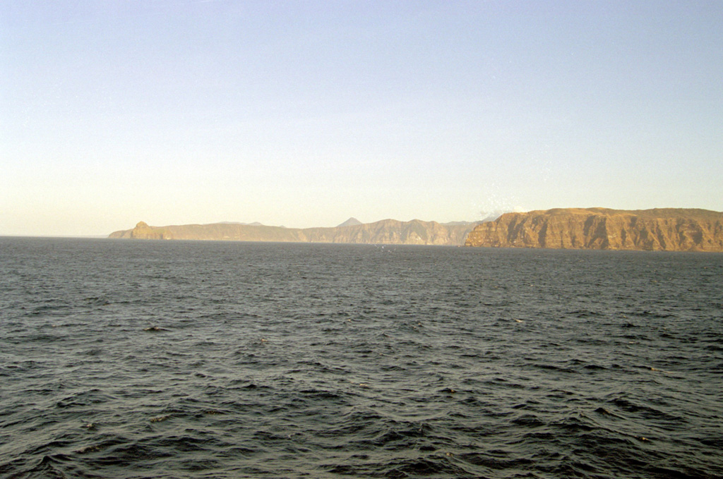 The Moekeshiwan caldera is seen here from the west with its NW rim at the right and the E rim on the left horizon. The 7 x 9 km caldera on southern Iturup Island formed about 9,400 years ago during one of the largest Holocene eruptions of the Kuril Islands.  Photo by Alexander Rybin, 2001 (Institute of Marine Geology and Geophysics, Yuzhno-Sakhalin).