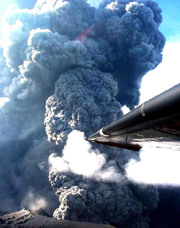 An ash plume rises from the east crater of Anatahan on 16 June 2003. The plume reached a maximum height of about 2.5 km in less than 40 seconds. This pulse of activity was accompanied by intense tremor and earthquakes that were recorded by the single seismic station on the island. Photo by U.S. Geological Survey, Hawaiian Volcano Observatory, 2003.