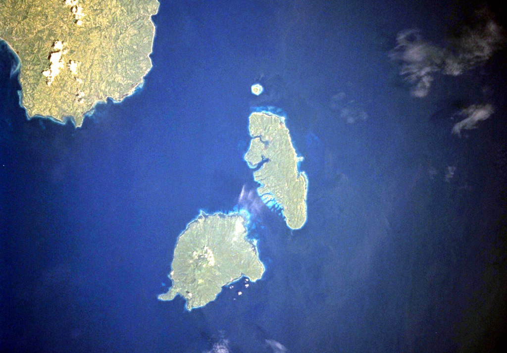 The Sarangani Islands lie about 20 km across Sarangani Strait from the Batulaki Peninsula (upper left), which forms the southern tip of Mindanao Island. Balut volcano occupies the lower island in this NASA Space Shuttle image (N is to the upper left). The volcano has hot springs and areas on the flanks have undergone thermal alteration. NASA Space Shuttle image STS099-704-41, 2000 (http://eol.jsc.nasa.gov/).